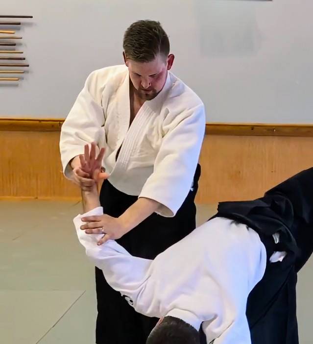 Burgess doing an Aikido hold